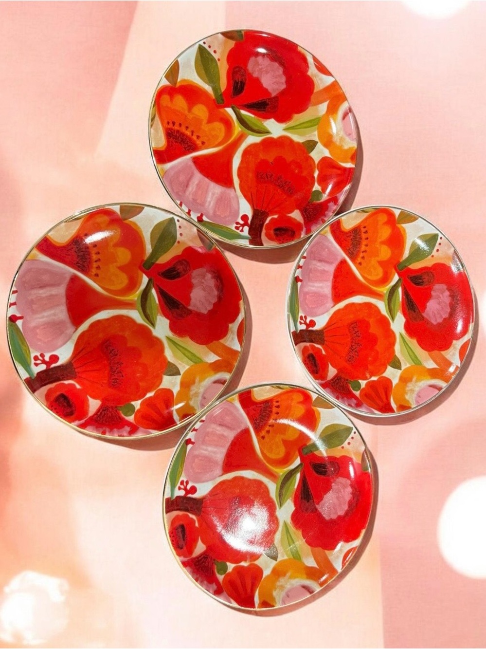 Set of four Hallmark Mercedes Lagunas floral ceramic appetizer plates.